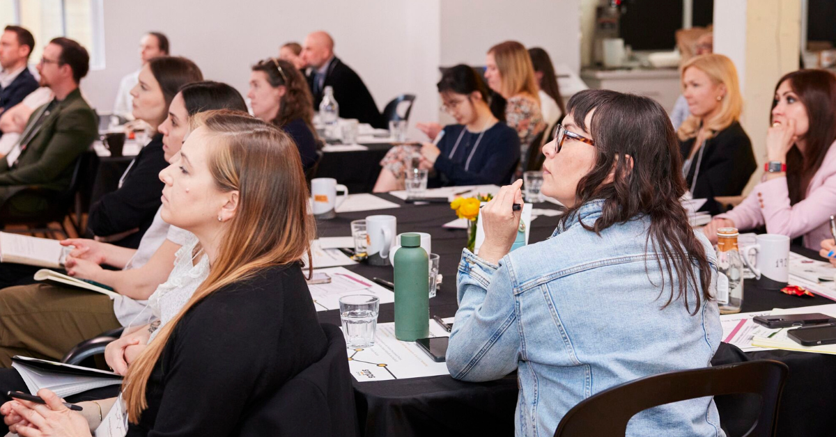 Several members of SMPS listening intently to the keynote speaker of the Annual Symposium.